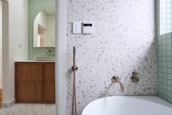 Round white sink with brass mixer tap as part of bathroom modifications in St Peters